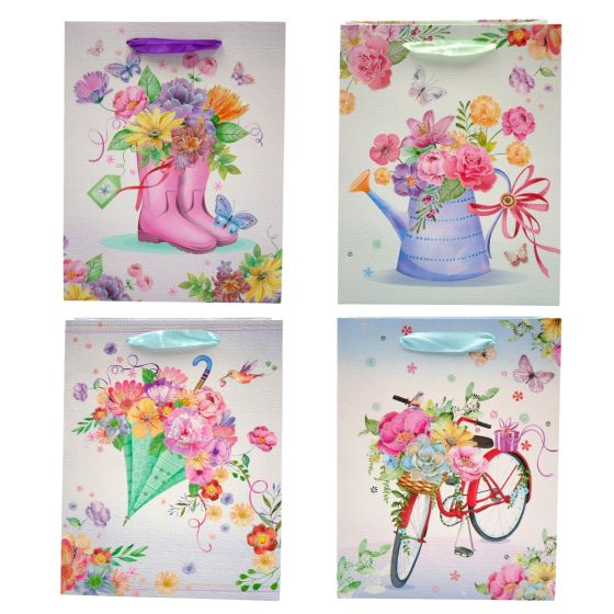 Floral and butterfly design gift bags with glitter detail.
