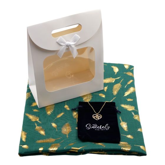 Ladies complete gift set includes a Bottle Green/Gold colour foil feather print scarf, Gold colour plated pierced Mum heart design pendant with genuine Clear crystal stones, a Navy velvet drawstring gift pouch and a White card gift bag with a clear window