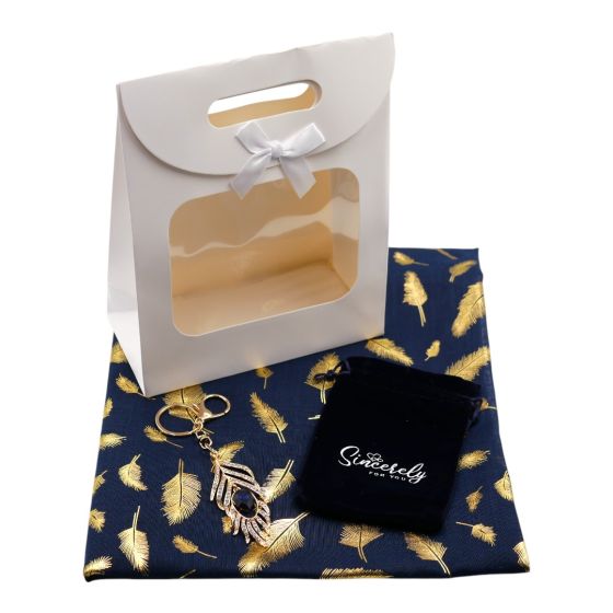 Ladies complete gift set includes a Navy/Gold colour foil feather print scarf, Gold colour plated feather design bag charm with genuine crystal stones, a Navy velvet drawstring gift pouch and a White card gift bag with a clear window and a velcro fastenin