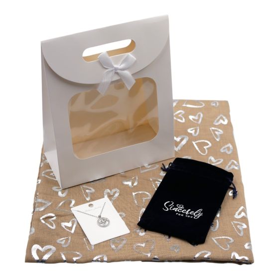 Ladies complete gift set includes a Beige/Silver colour foil heart print scarf, Rhodium colour plated mum heart pendant with genuine crystal stones, a Navy velvet drawstring gift pouch and a White card gift bag with a clear window and a velcro fastening.
