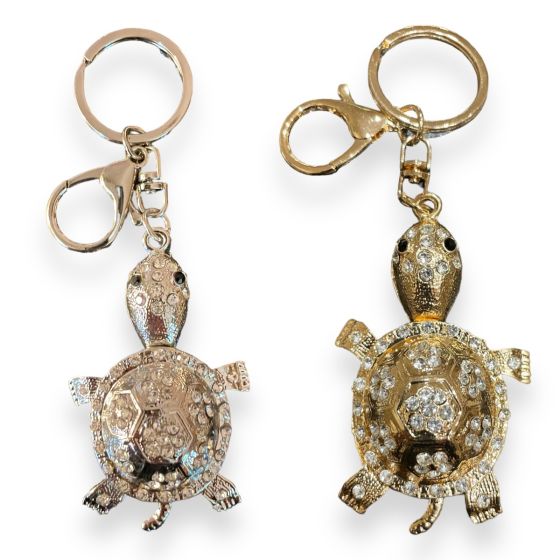 Turtle  bag charm available in Rhodium colour plating and Gold Colour plating ,embelished with genuine crystal stones and enamel detail  .

Sold as a pack of 3 per colour or 4 assorted .

Size approx  Turtle 4 x 8cm total size 13.5 cm .