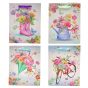 Floral and butterfly design gift bags with glitter detail.
