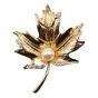 Venetti collection, Gold colour plated maple leaf design brooch with genuine Clear crystal stones and a imitation pearl.
