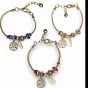 Ladies gold colour plated charm bracelet with asorted charms, including a gold colour plated tree of life with enameled detail and an assortment of charms with imitation pearls ,enamel  ,and genuine crystal stones .

Available in Royal Blue ,Baby Pink a