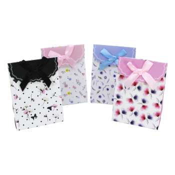 Mini floral gift bags with a satin bow and velcro fastening.
