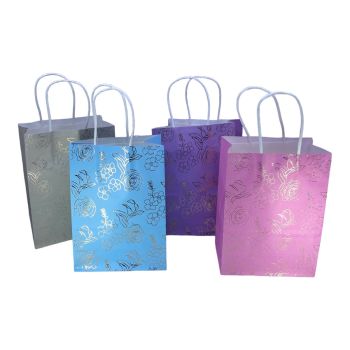 paper gift bag with foil roses and a raffia handle in assorted colours of lilac baby pink lilac and baby blue 