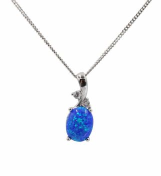 Rhodium plated sterling Silver pendant with synthetic Blue opal and Clear cubic zirconia stones.
