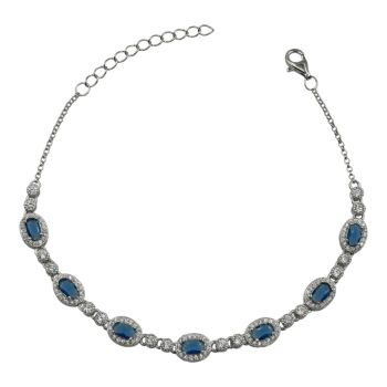 Rhodium plated sterling Silver bracelet with Clear and Sapphire cubic zirconia stones.