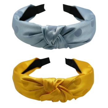 Wide polka dot satin alice band with a centered knot.
