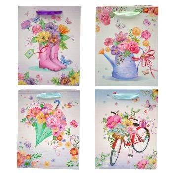 Floral and butterfly design gift bags with glitter detail.
