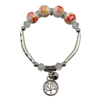 Rhodium colour plated, elasticated bracelet with floral print beads, genuine Clear crystal stones and a tree of life charm.
