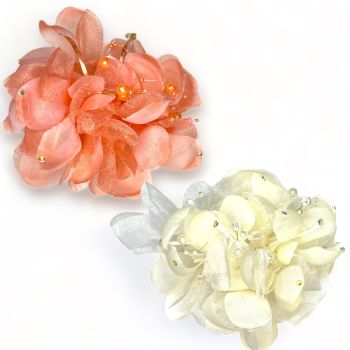 Pretty hair flower with imitation crystals and pearls with genuine crystal stones on silky cord .

Can be worn in the hair or as a brooch .

Available in  Peach and Cream 

Sold as a pack of 3 per colour or 4 assorted .

Size approx 18 x 18 cm