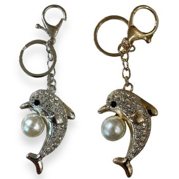 Dolphin with imitation pearl ball and genuine crystal stones. Available in Gold colour plating and Rhodium colour plating .

Sold as a pack of 3 per colour or 4 assorted .

Size approx .Dolphin 7 x 4 cm  ,Total size 13 .5 cm .