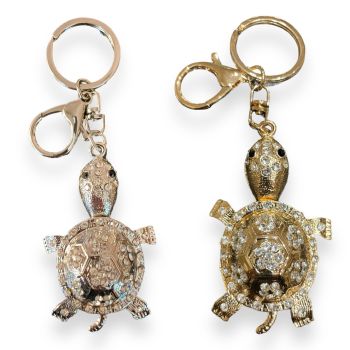 Turtle  bag charm available in Rhodium colour plating and Gold Colour plating ,embelished with genuine crystal stones and enamel detail  .

Sold as a pack of 3 per colour or 4 assorted .

Size approx  Turtle 4 x 8cm total size 13.5 cm .